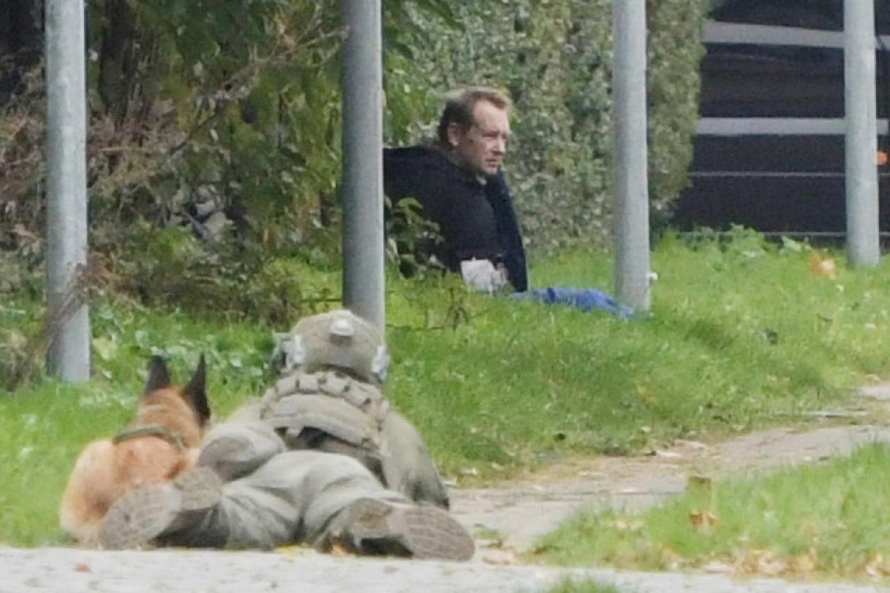 Peter Madsen is seen surrounded by police in Albertslund