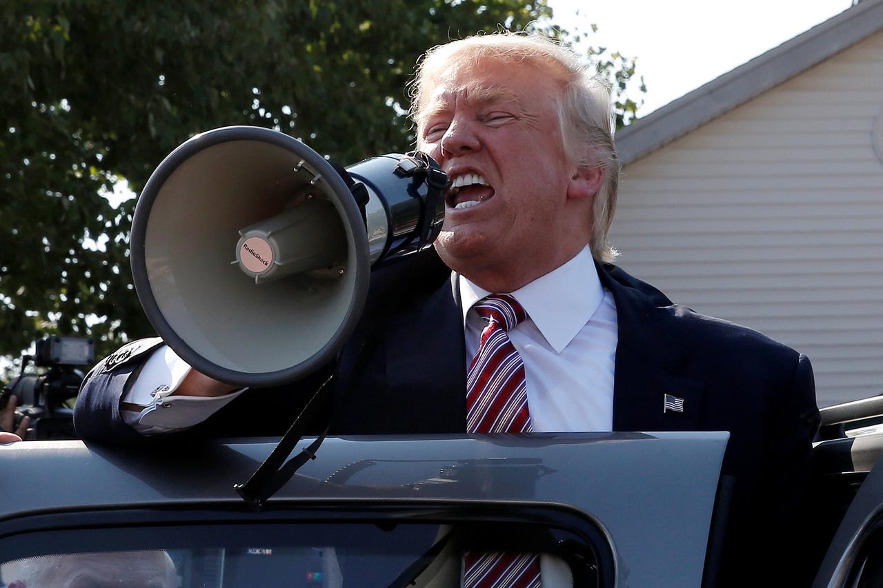 Republican presidential nominee Donald Trump speaks to supporters through a bullhorn during a campaign stop at the Canfield County Fair in Canfield, Ohio, U.S., September 5, 2016.  REUTERS/Mike Segar     TPX IMAGES OF THE DAY     