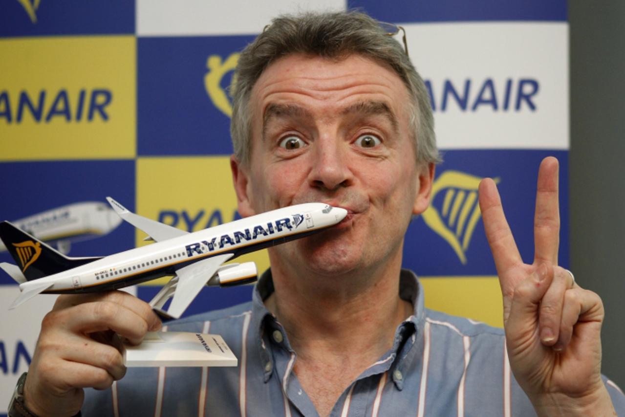 'Ryanair Chief Executive Michael O\'Leary poses for a photo after a news conference in Barcelona February 7, 2012. O\'Leary announced that Ryanair will open six new routes this summer season at Barcel