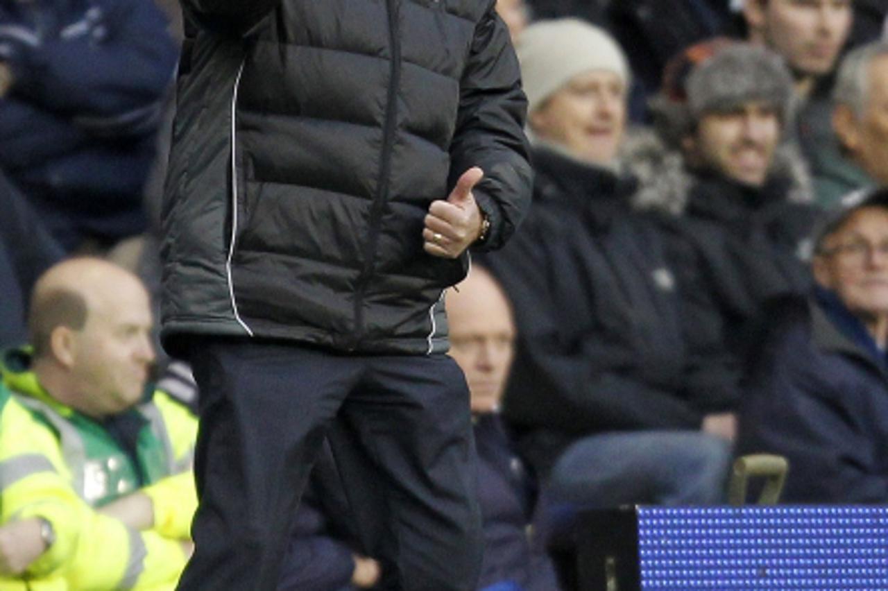 'Tottenham Hotspur\'s English manager Harry Redknapp gestures during the English FA Cup 3rd Round football match between Tottenham Hotspur and Cheltenham Town at White Hart Lane in north London, Engla