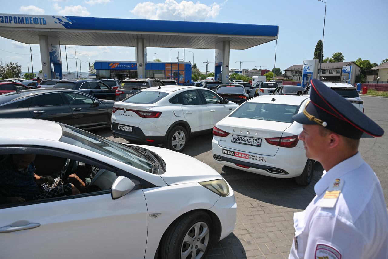 Cossacks keep order and prevent conflicts at a petrol station in the Russian Black Sea resort of Anapa