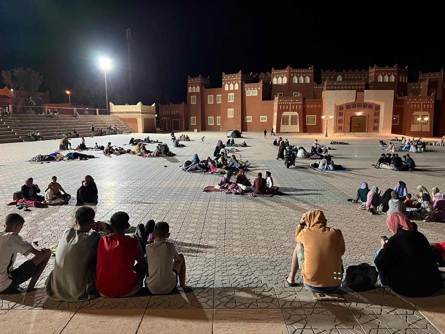 (230909) -- OUARZAZAT, Sept. 9, 2023 (Xinhua) -- This photo taken with a mobile phone shows residents taking shelter at an open space after an earthquake in Ouarzazate, Morocco, Sept. 9, 2023. At least 30 people have been killed in a strong earthquake that jolted Morocco on Friday night, local media reported, adding that the death toll is expected to increase. (Xinhua/Wang Dongzhen) Photo: Wang Dongzhen/XINHUA