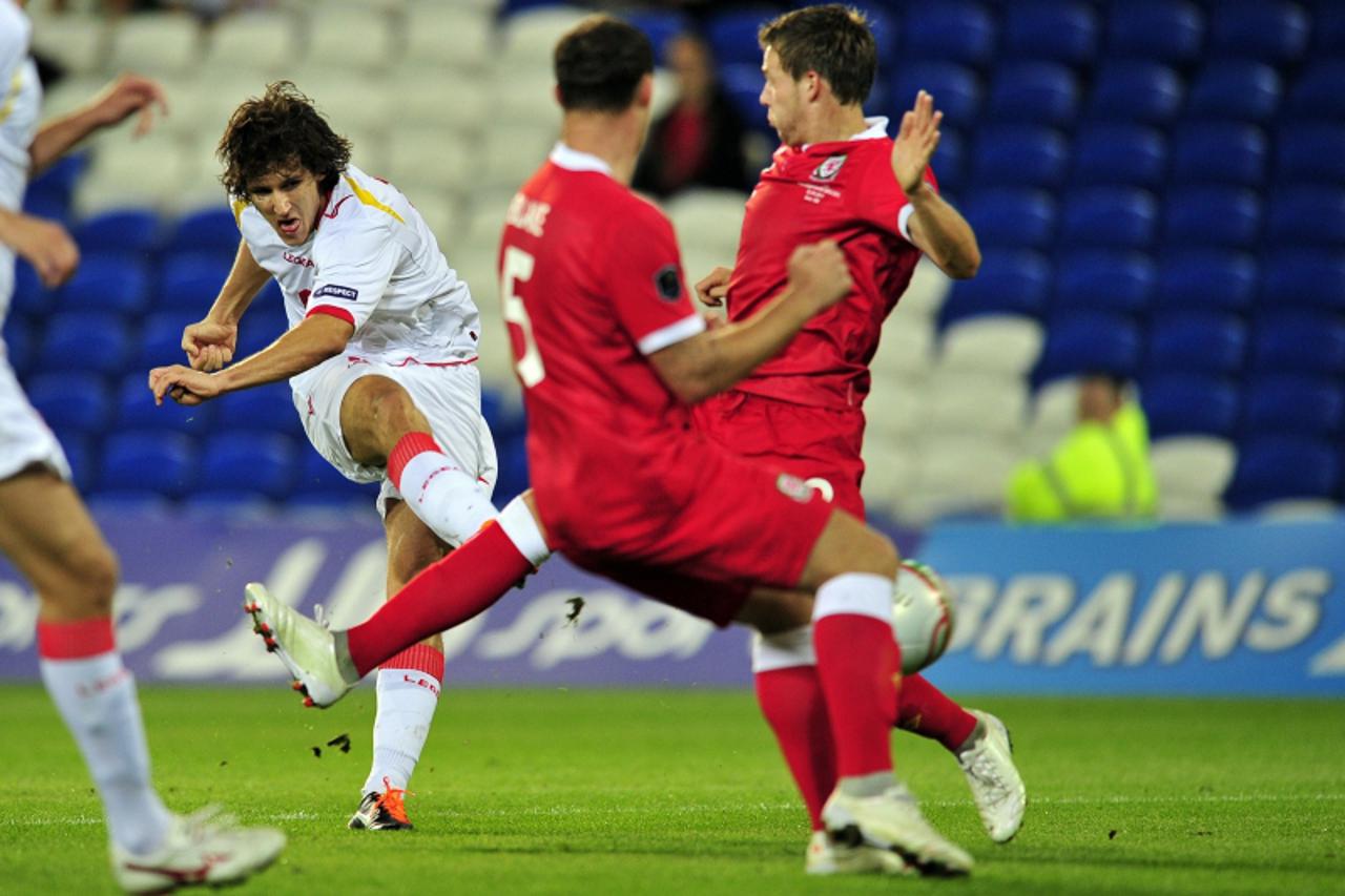 \'Montenegro\'s Stevan Jovetic (L) scores a goal during the Euro 2012, Group G qualifying football match between Wales and Montenegro at Cardiff City Stadium in Cardiff, Wales, on September 2, 2011. A