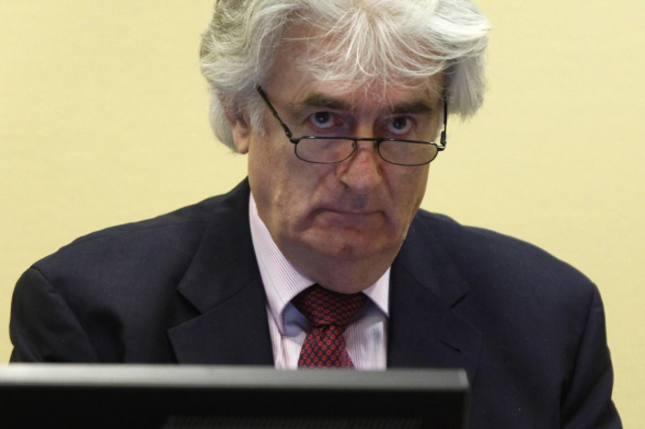 'Former Bosnian Serb leader Radovan Karadzic appears in the courtroom of the ICTY War Crimes tribunal in The Hague November 3, 2009. Karadzic appeared on Tuesday for an administrative hearing in his w