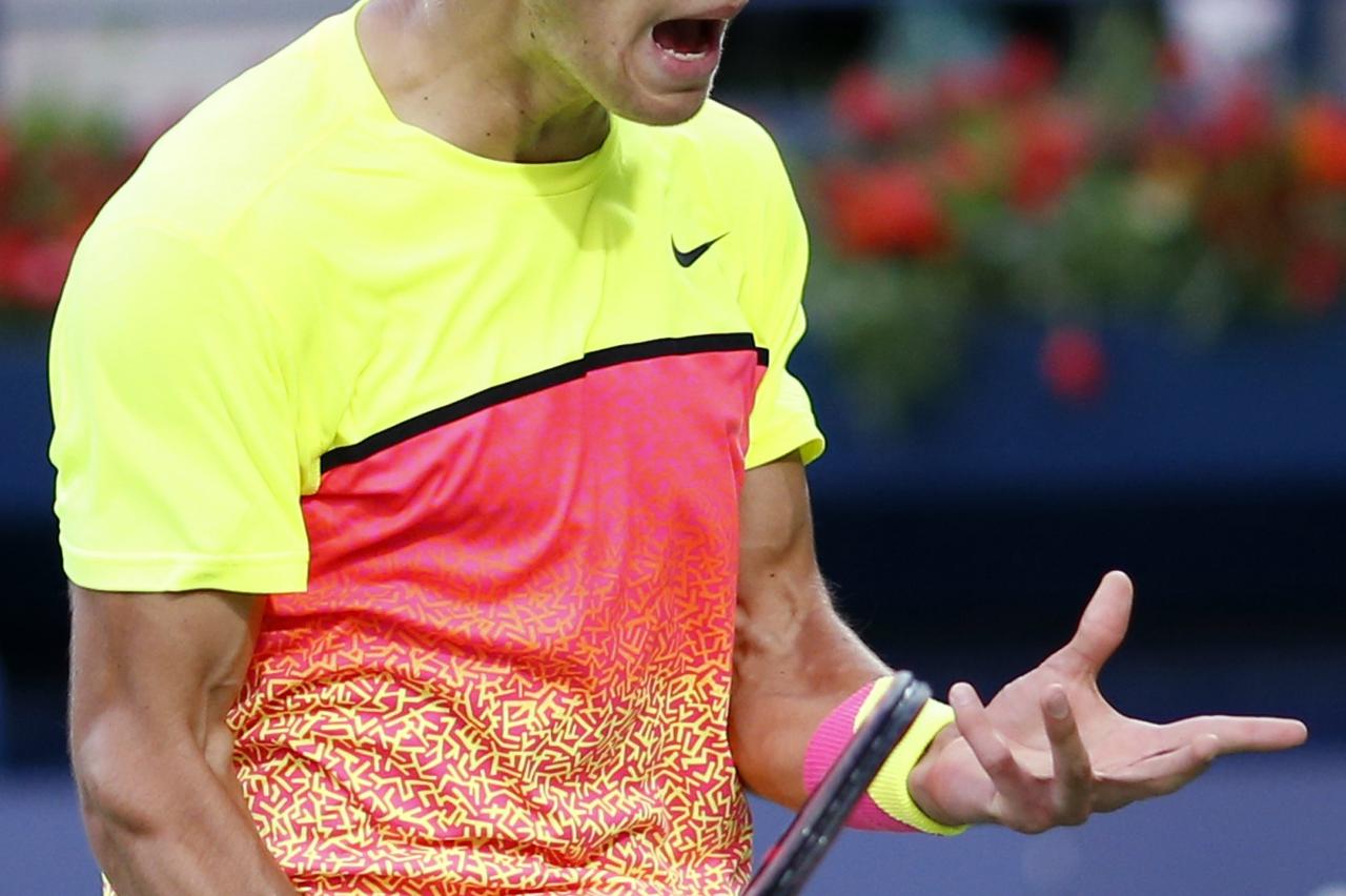 Borna Coric of Croatia reacts during his semi-final match against Roger Federer of Switzerland at the ATP Championships tennis tournament in Dubai, February 27, 2015. Federer trounced Coric 6-2 6-1 at the Dubai Championships on Friday to set up a potentia