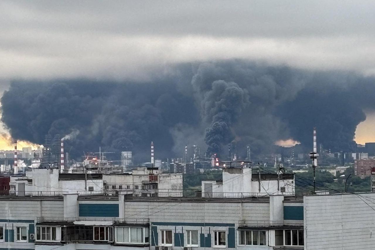 Thick plumes of smoke with flames rise from an oil refinery in Moscow