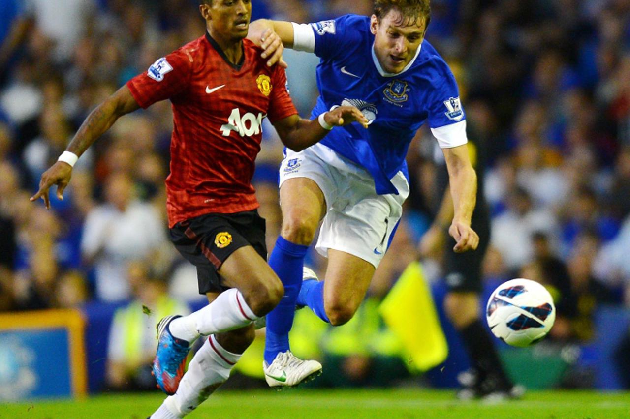 'Manchester United\'s Portuguese midfielder Nani (L) vies for the ball with Everton\'s Croatian forward Nikica Jelavic during their English Premiership football match at Goodison Park in Liverpool on 