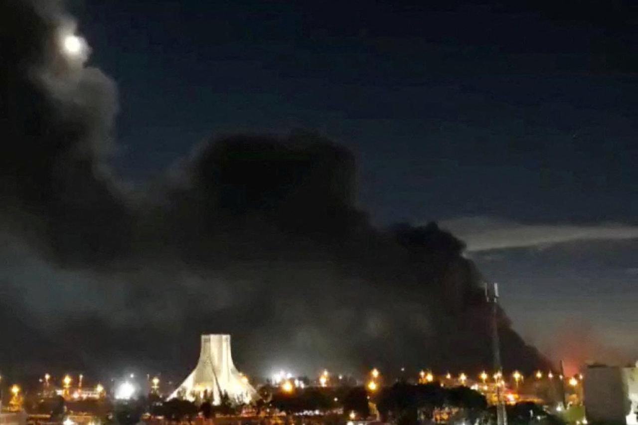 Smoke rises over Azadi Square following a strike, amid the U.S.-Israeli conflict with Iran, in Tehran