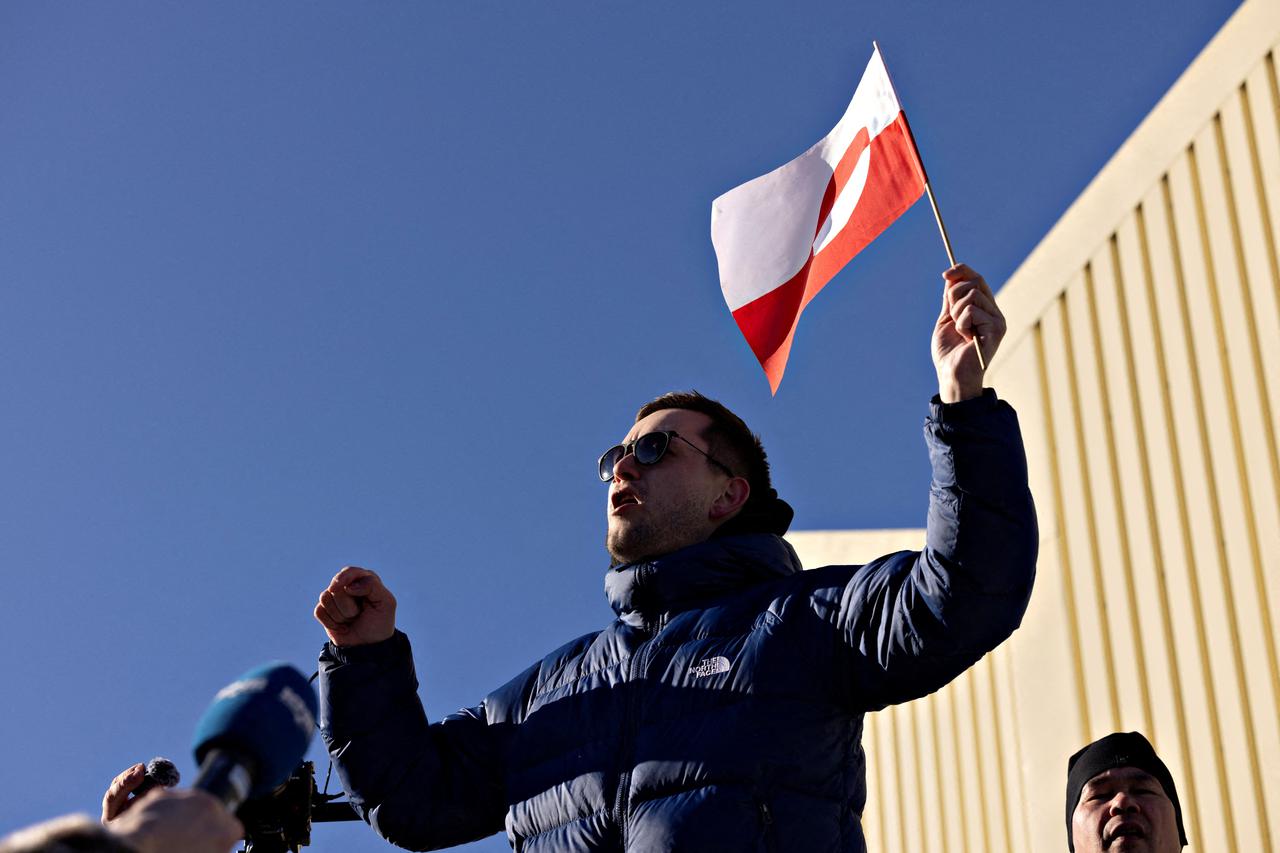 People protest under the slogan, "Greenland belongs to the Greenlandic people", in Nuuk