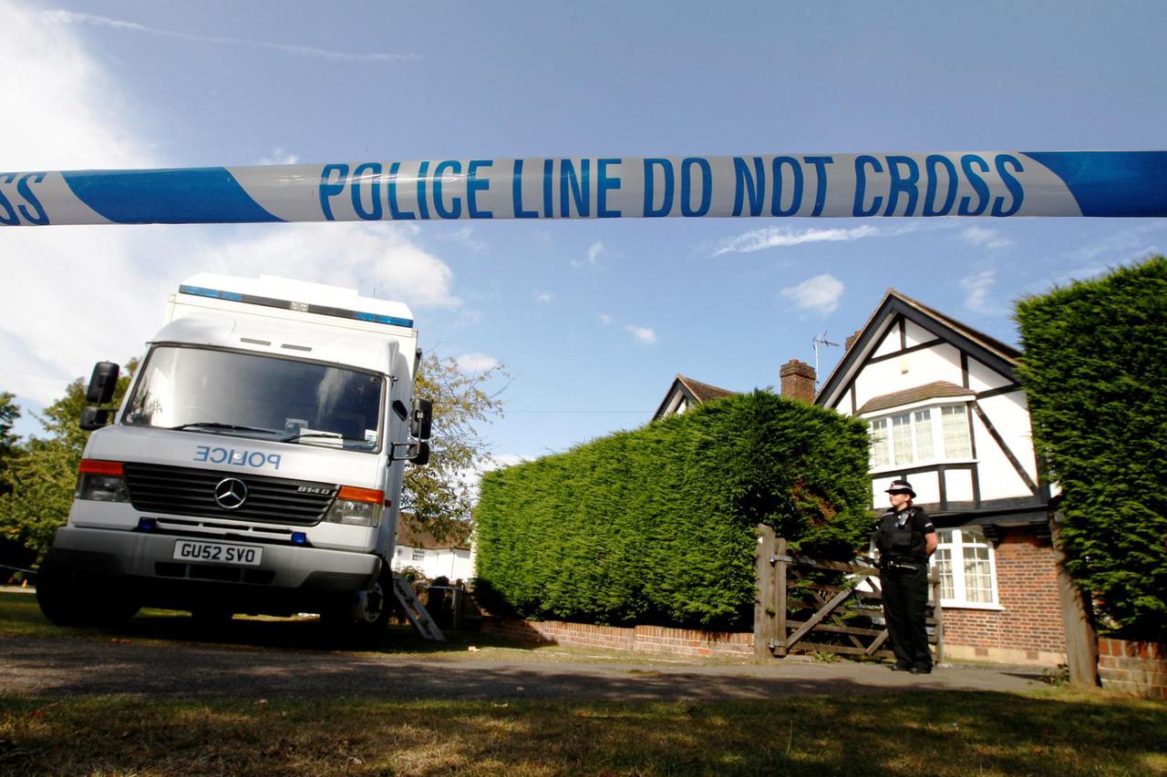 FILE PHOTO: A police officer stands by a cordon close to the house of Saad al-Hilli and his family in Claygate near London