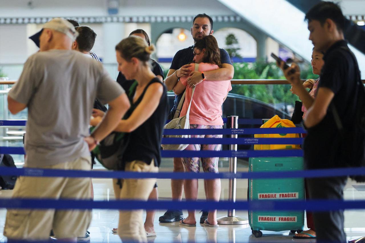 Stranded passengers at I Gusti Ngurah Rai International Airport after flights to Doha, Dubai, and Abu Dhabi were cancelled following strikes on Iran launched by the United States and Israel, in Kuta