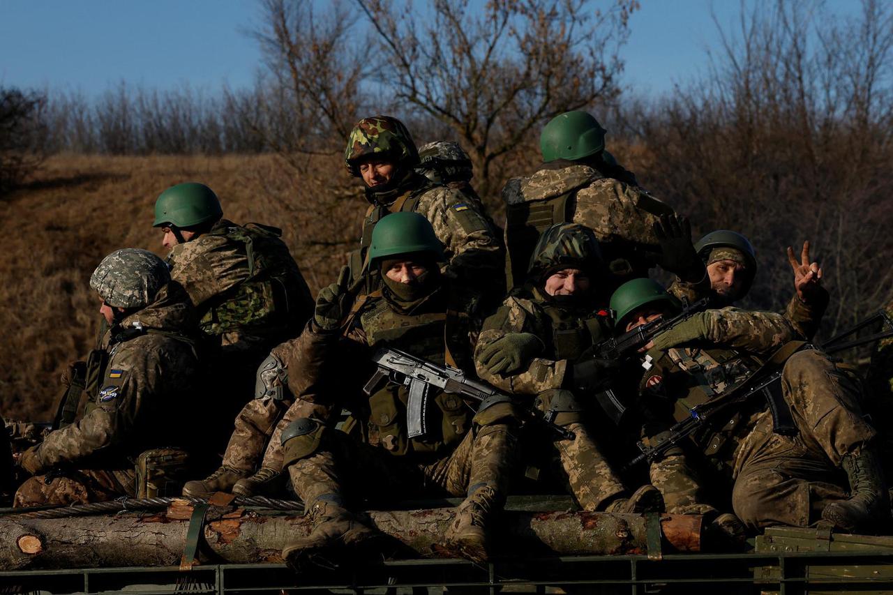 Soldiers from Carpathian Sich international battalion conduct manoeuvres near the front line, in Kreminna
