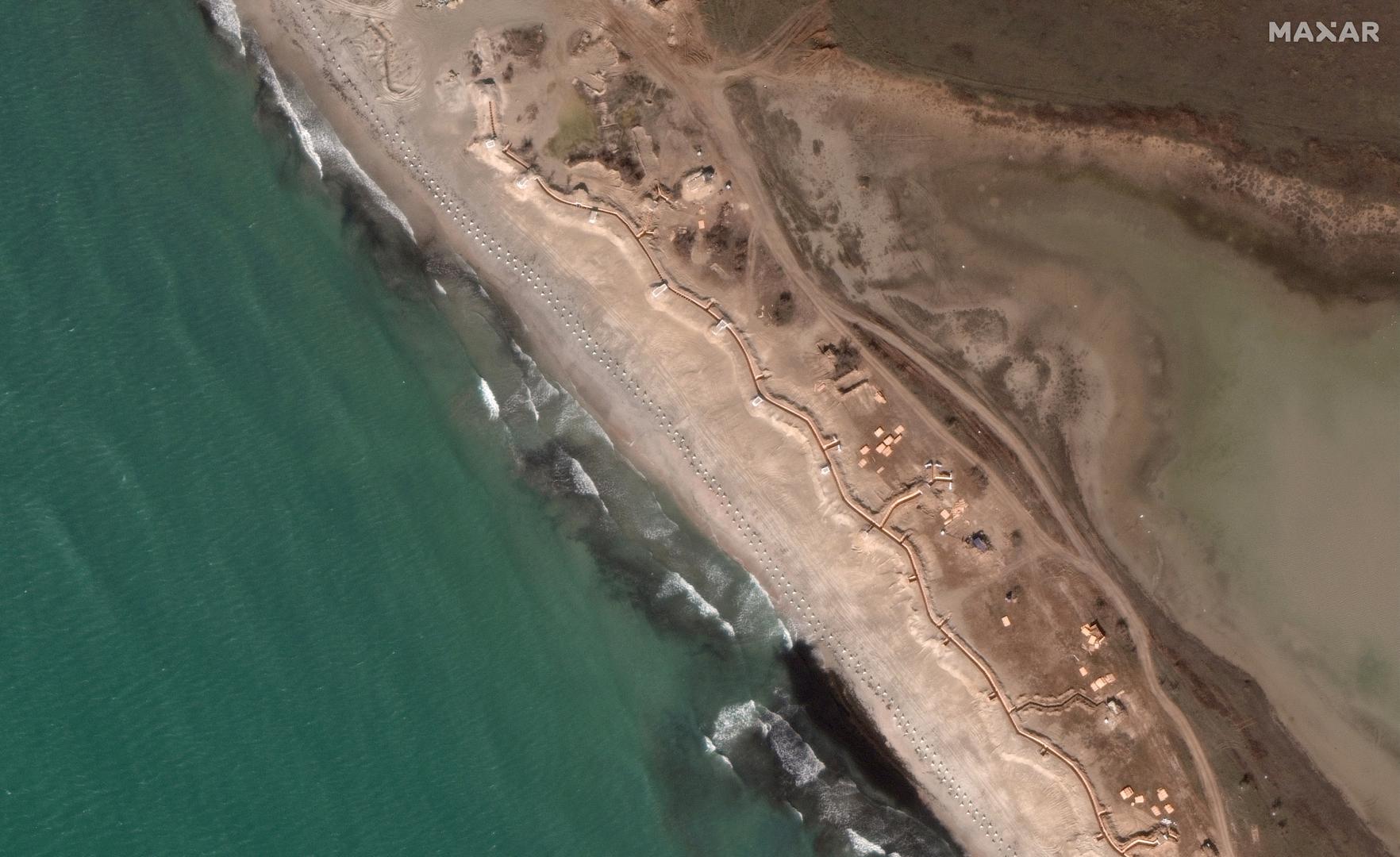 A satellite image shows an overview of fortifications built by the Russian army, including "dragon's teeth" and trenches, stretching along the beach, amid the Russia-Ukraine conflict, in Yevpatoriya, Crimea March 12, 2023. Maxar Technologies/Handout via REUTERS THIS IMAGE HAS BEEN SUPPLIED BY A THIRD PARTY. NO RESALES. NO ARCHIVES. MANDATORY CREDIT. DO NOT OBSCURE LOGO Photo: MAXAR TECHNOLOGIES/REUTERS