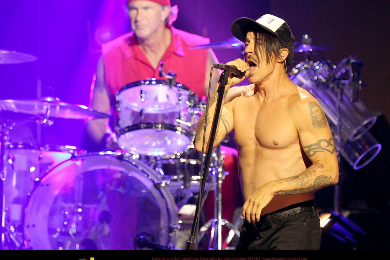 'US singer Anthony Kiedis (R), drummer Chad Smith and their band Red Hot Chili Peppers present their latest album \'I\'m With You\' in a concert at E-Werk in Cologne, Germany, 30 August 2011. The conc