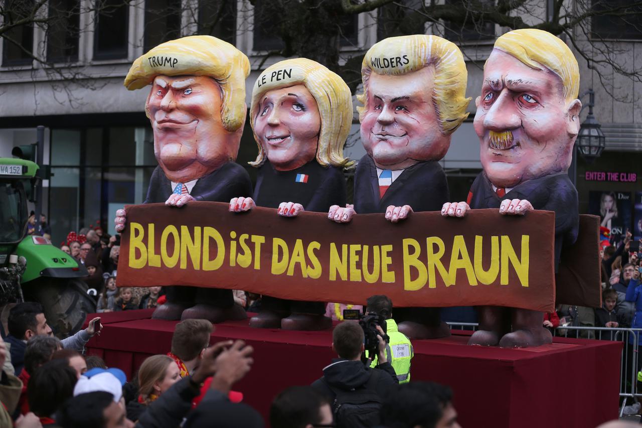 A topical float comparing US-President Trump, French presidential candidate Le Pen, Dutch politician Wilders and Adolf Hitler can be seen at the shrove monday carnival parade in Duesseldorf, Germany, 27 February 2017. 'Uns kritt nix klein - Narrenfreiheit