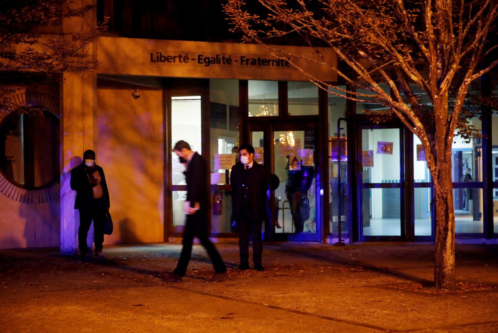 Stabbing attack in the Paris suburb of Conflans St Honorine People are seen outside an entrance area near the scene of a stabbing attack in the Paris suburb of Conflans St Honorine, France, October 16, 2020. REUTERS/Charles Platiau CHARLES PLATIAU