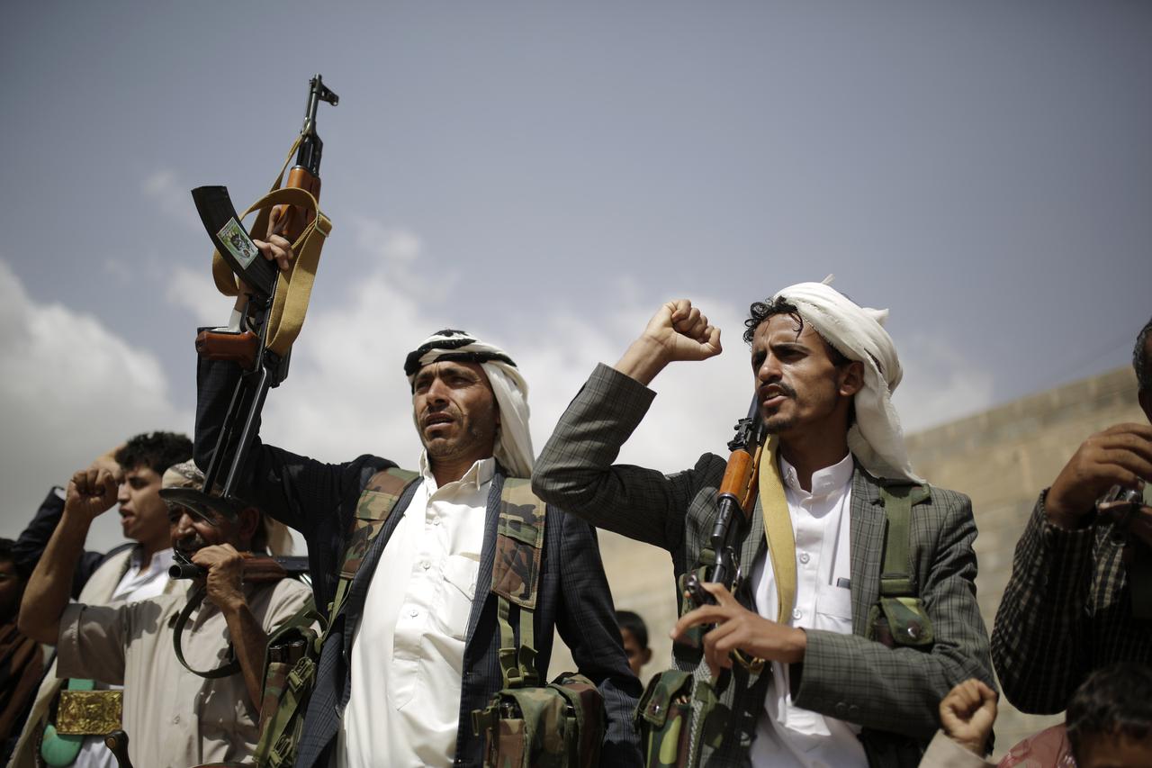 FILE PHOTO: Houthi policeman takes part in a protest against recent U.S.-led strikes on Houthi targets, near Sanaa