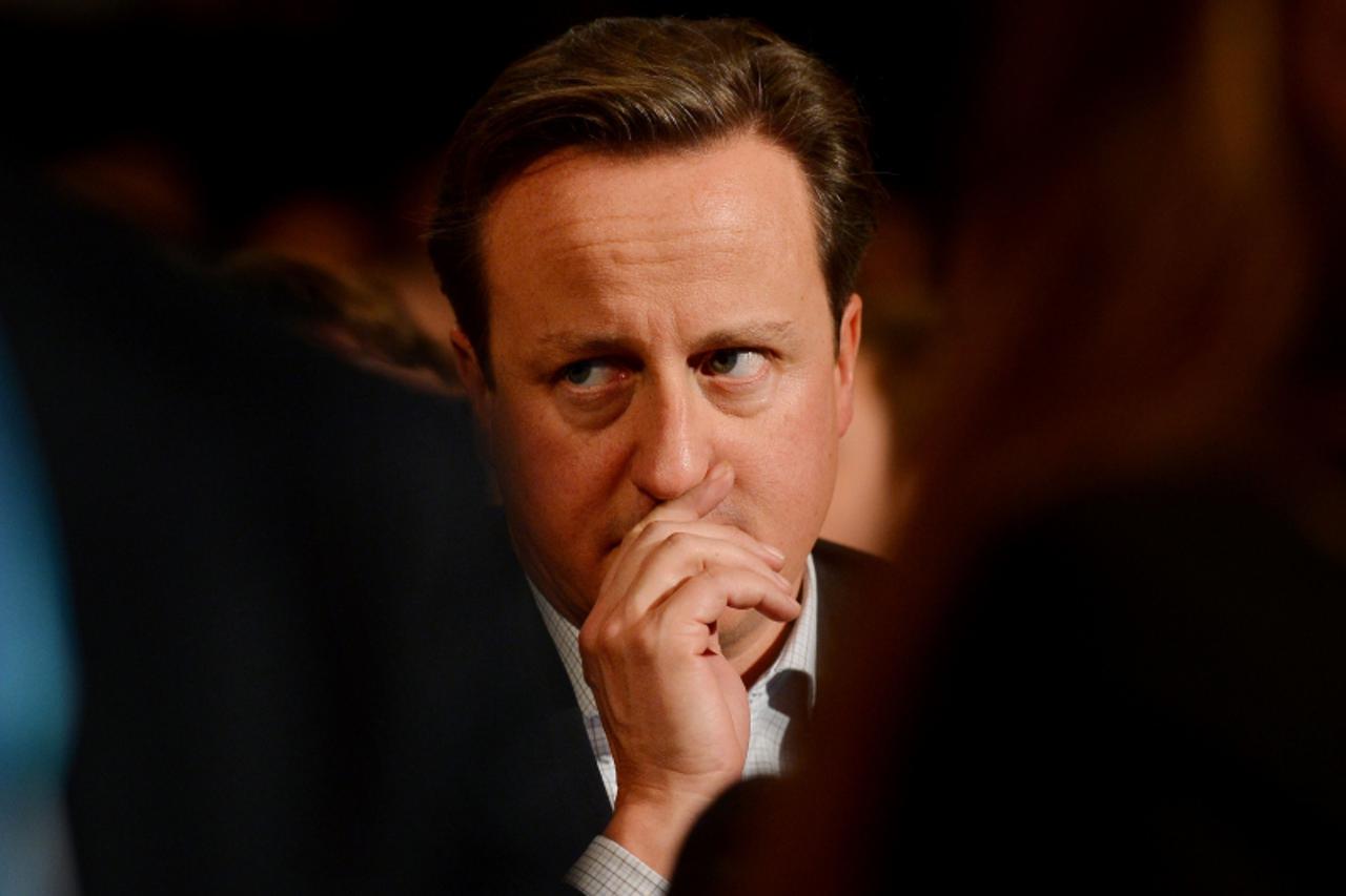 'Prime Minister and Leader of the Conservative Party David Cameron attends a speech by Secretary of State for Foreign and Commonwealth Affairs William Hague during the first day of the Conservative pa