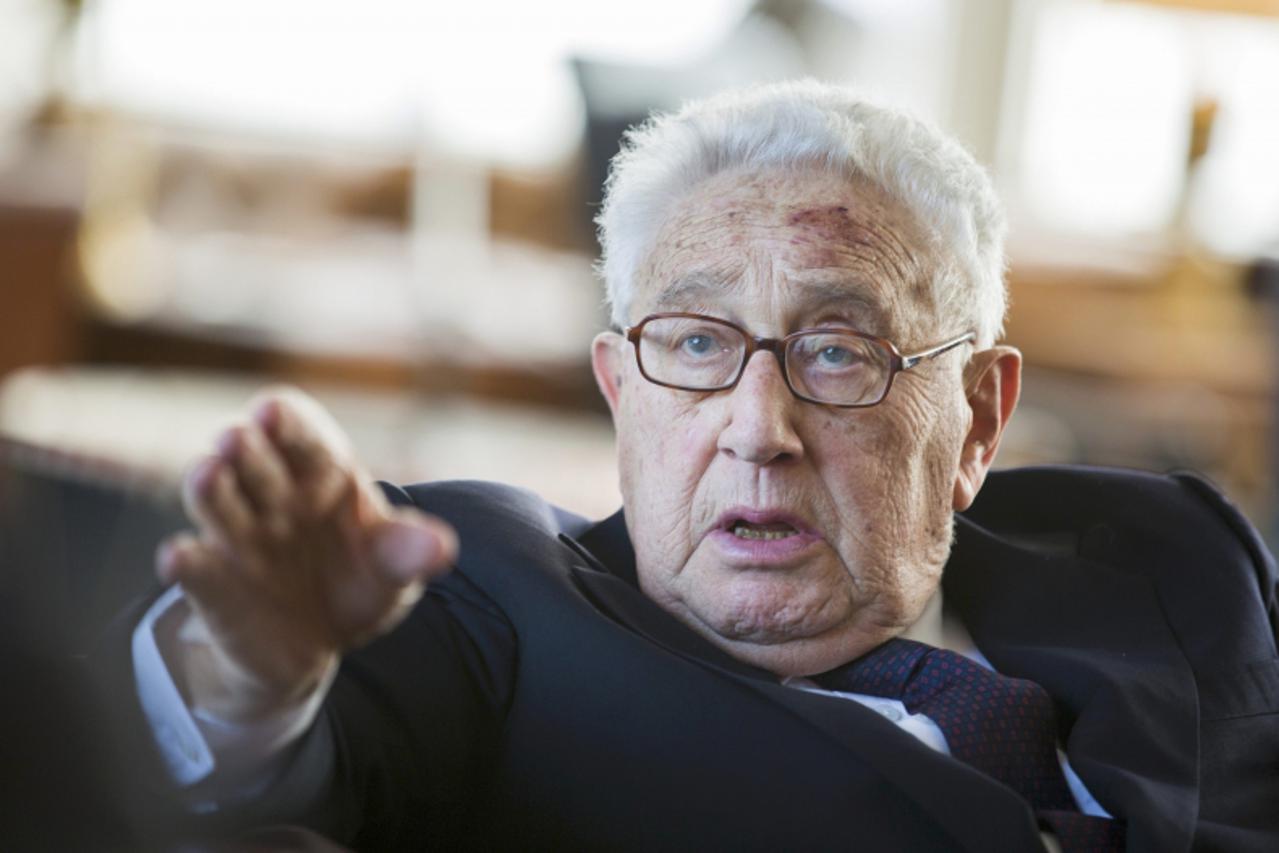 'Former U.S. Secretary of State Henry Kissinger gestures during a reception for his 90th birthday in Berlin, June 11, 2013. The reception was held by German multimedia company Axel Springer AG. Kissin