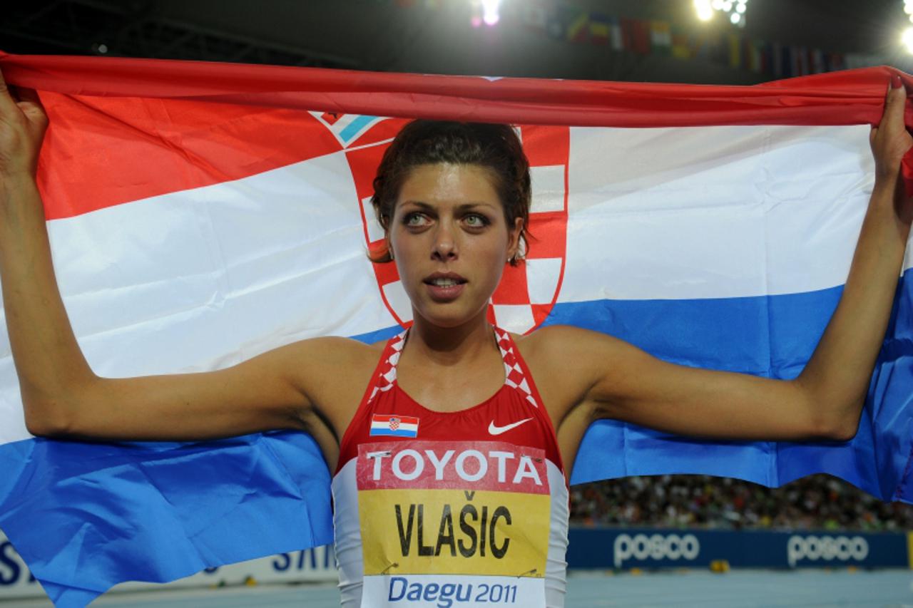 'Croatia\'s Blanka Vlasic reacts after winning silver in the women\'s high jump final at the International Association of Athletics Federations (IAAF) World Championships in Daegu on September 3, 2011