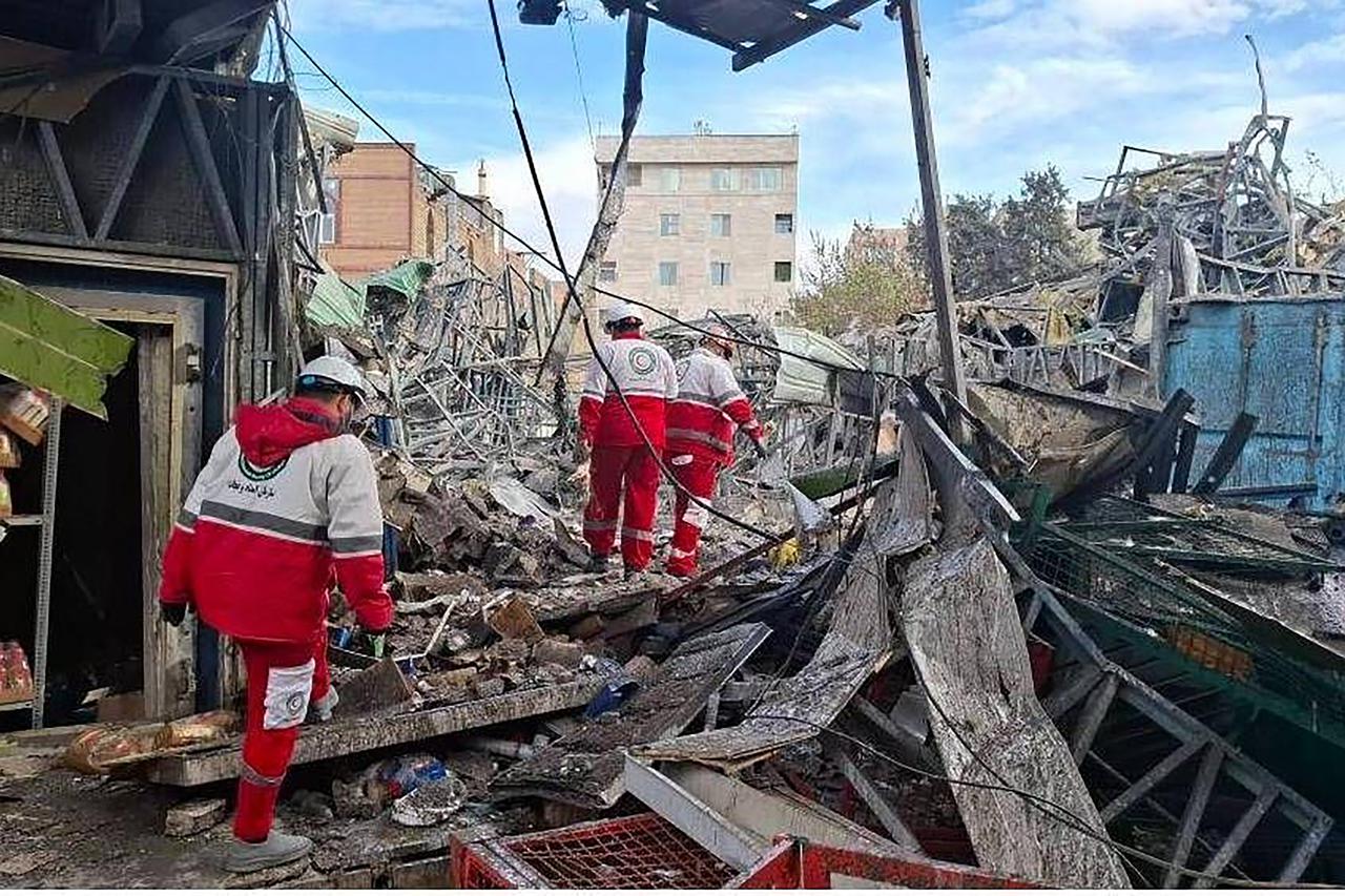 Iranian Rescue Teams Search Tehran Strike Site for Victims