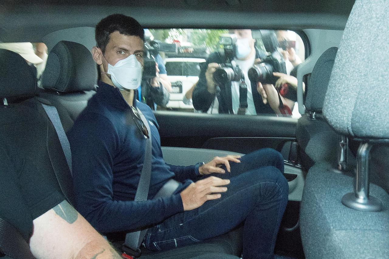 Serbian tennis player Novak Djokovic departs from the Park Hotel government detention facility before attending a court hearing at his lawyers office in Melbourne