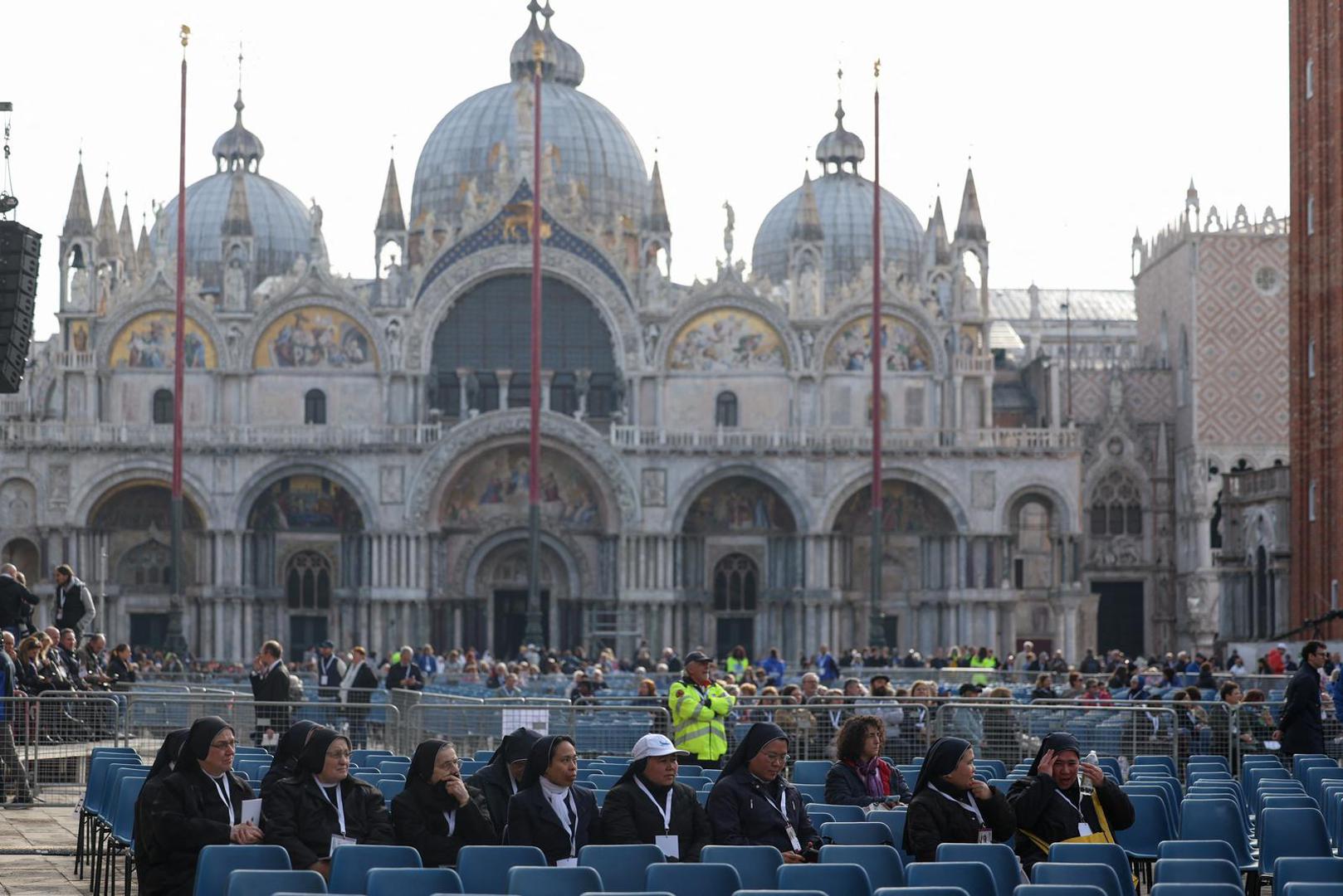 Nuns sit in Saint Mark’s Square, on the day Pope Francis celebrates the Holy Mass, in Venice, Italy, April 28, 2024. REUTERS/Claudia Greco Photo: CLAUDIA GRECO/REUTERS