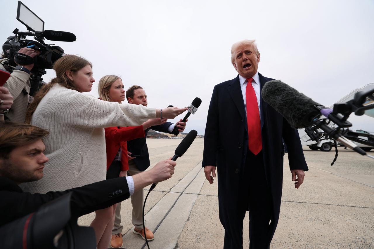 Trump speaks before boarding Air Force One as he departs for Florida