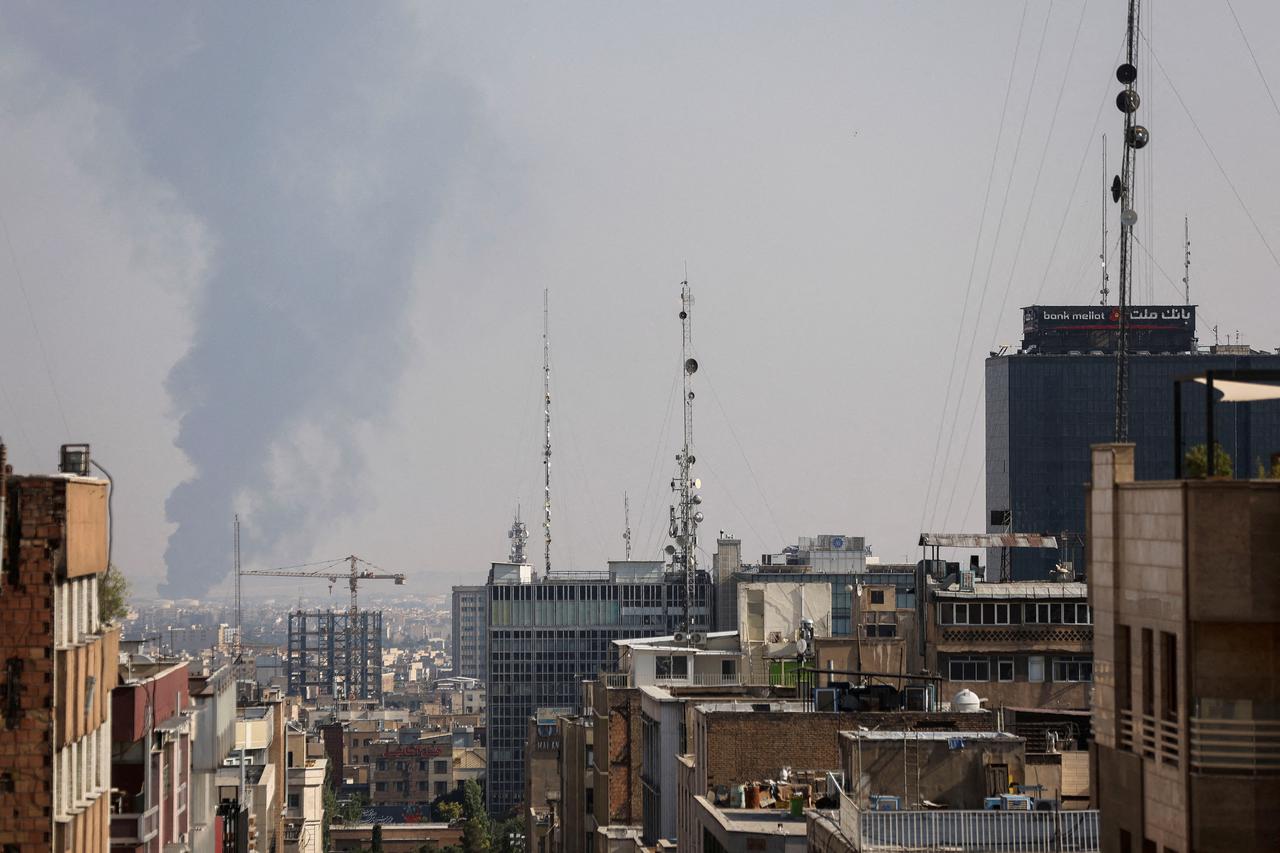Smoke rises following an Israeli attack on Tehran Oil Refinery, in south of Tehran