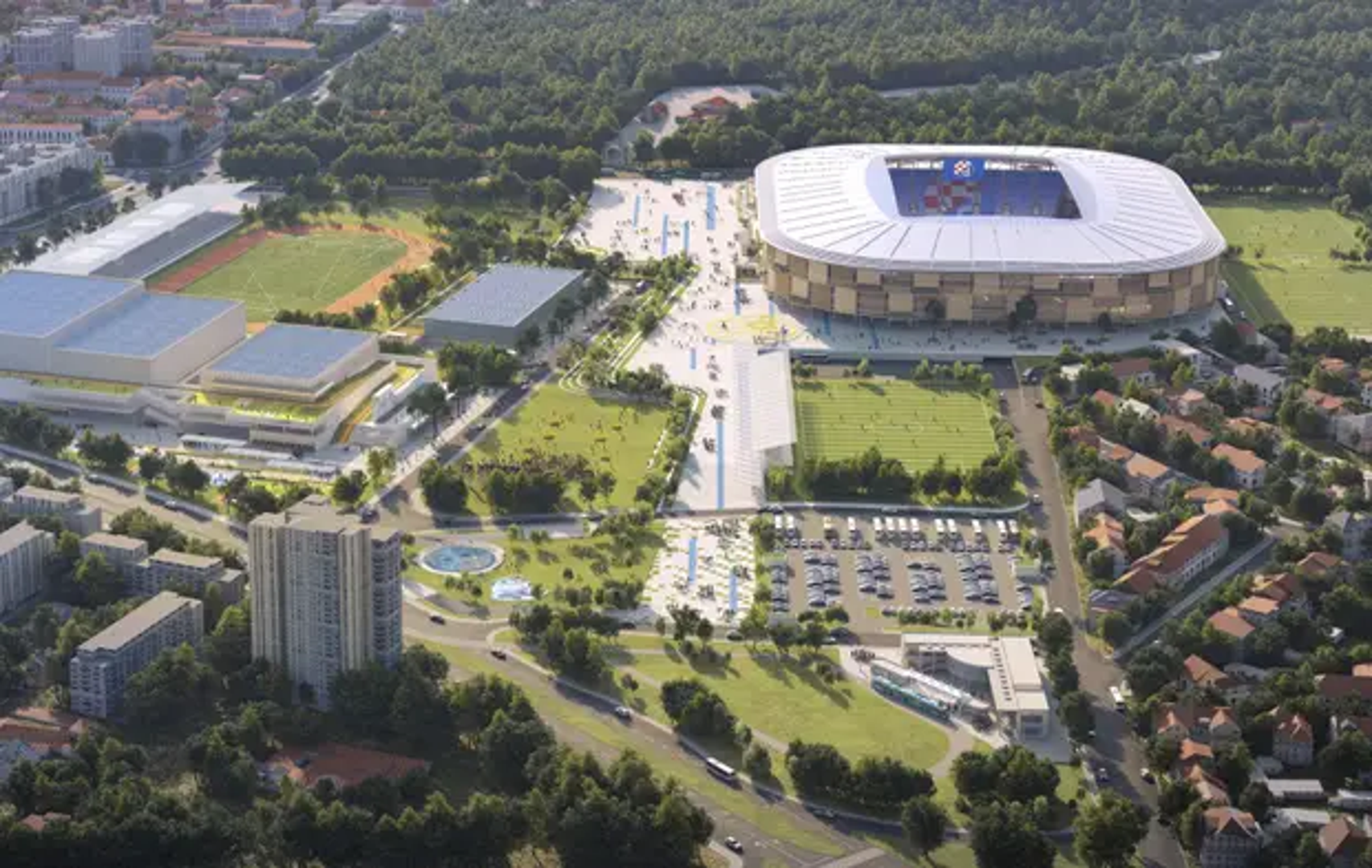 Slojevito pročelje od vertikalnih lamela, uvučenih terasa i zelenih niša obavija zaobljeni volumen stadiona, dok široki bijeli krov oblikuje kontinuirani prsten iznad tribinske zdjele. Vanjski ophodi i javni sadržaji raspoređeni su kroz više razina, uspostavljajući postupni prijelaz između građevine i parka.