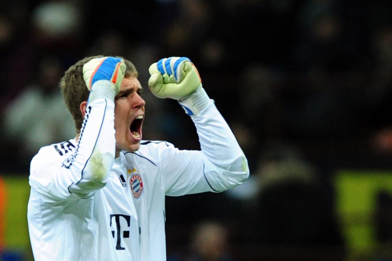 'Bayern Munich\'s goalkeeper Thomas Kraft celebrates after Bayern Munich\'s striker Mario Gomez scored a goal against Inter during their the Champions League football match on February 23, 2011 at San