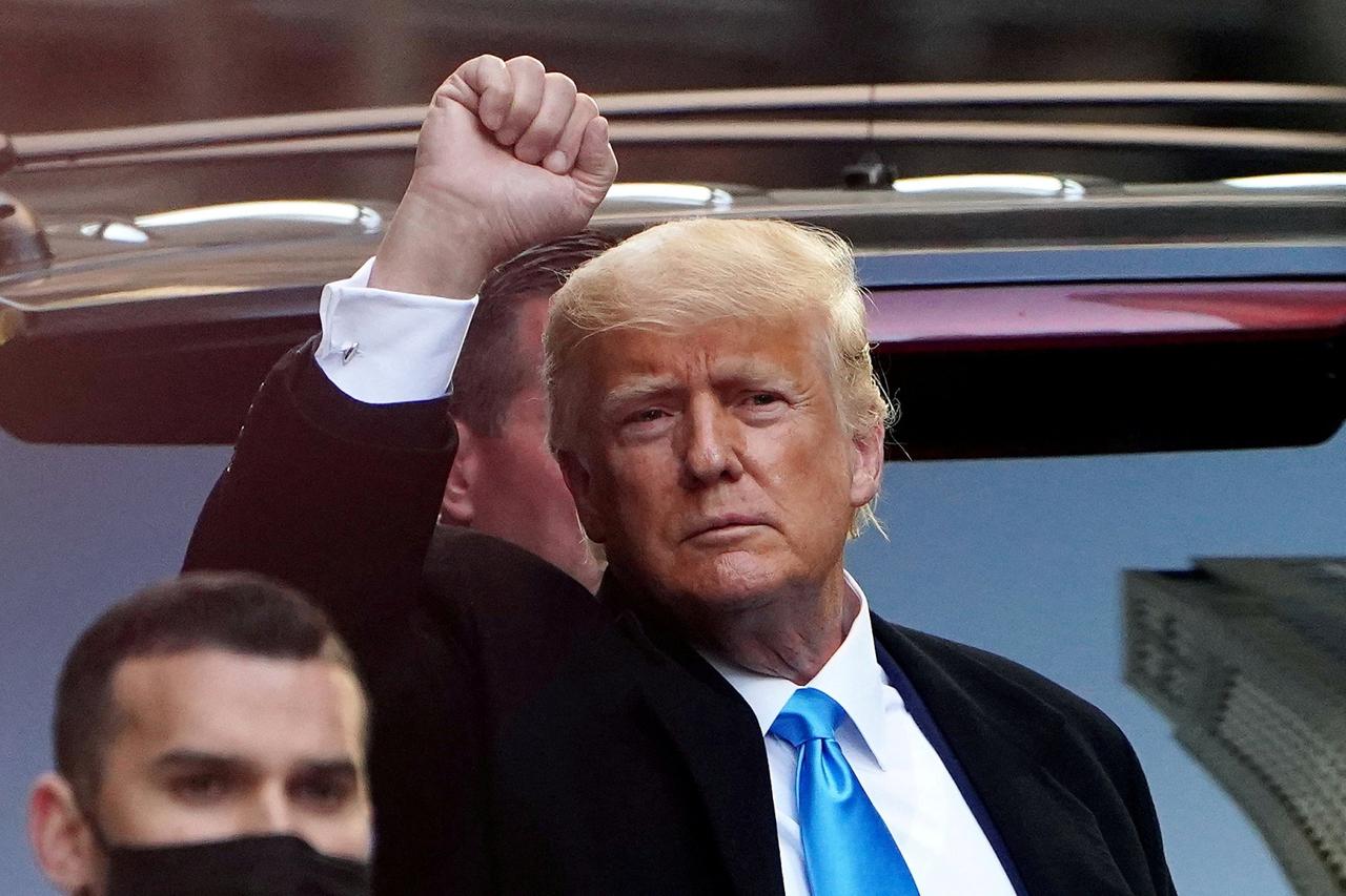 FILE PHOTO: Trump acknowledges people as he gets in his SUV outside Trump Tower in New York City