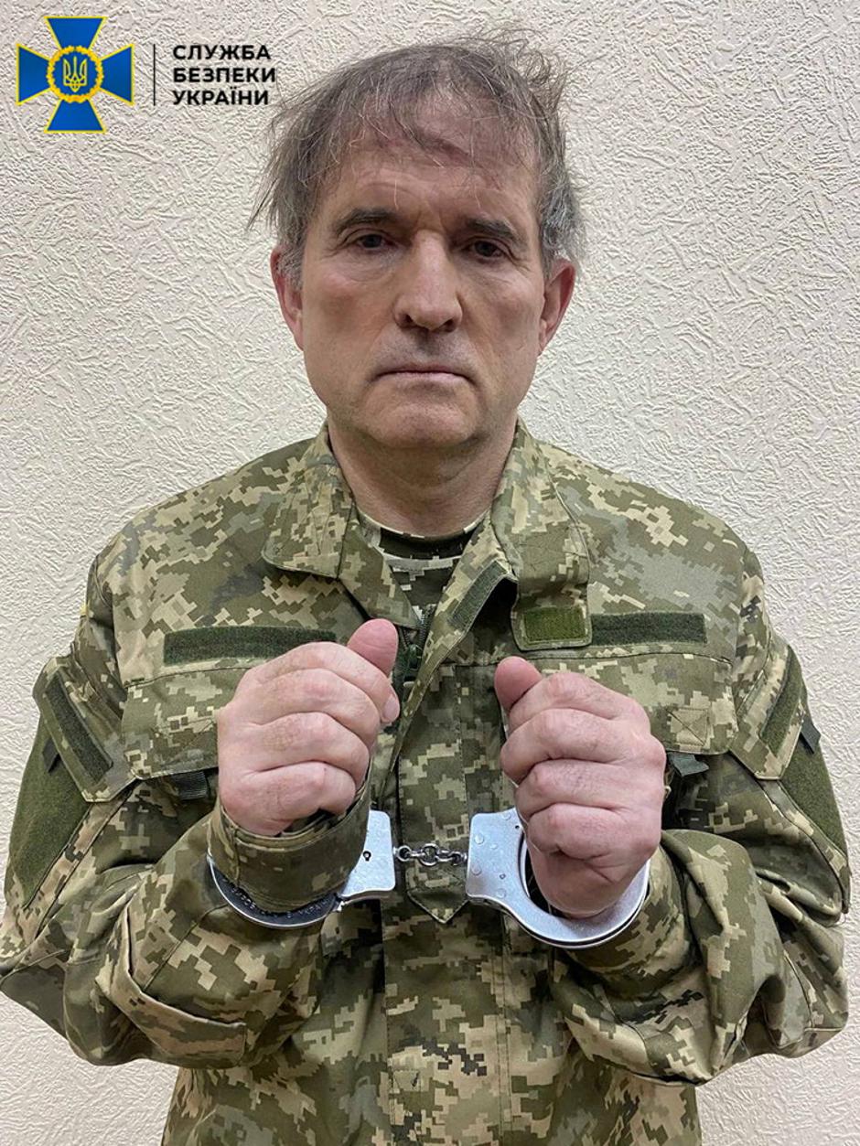 Pro-Russian Ukrainian politician Viktor Medvedchuk is seen in handcuffs while being detained by security forces in unknown location in Ukraine