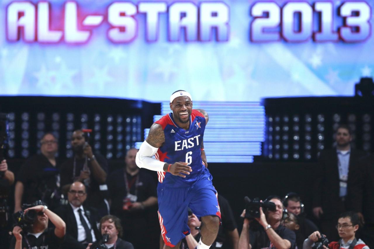 'NBA All-Star LeBron James of the Miami Heat smiles as he runs back up the court during the 2013 NBA All-Star basketball game in Houston, Texas, February 17, 2013.  REUTERS/Lucy Nicholson (UNITED STAT