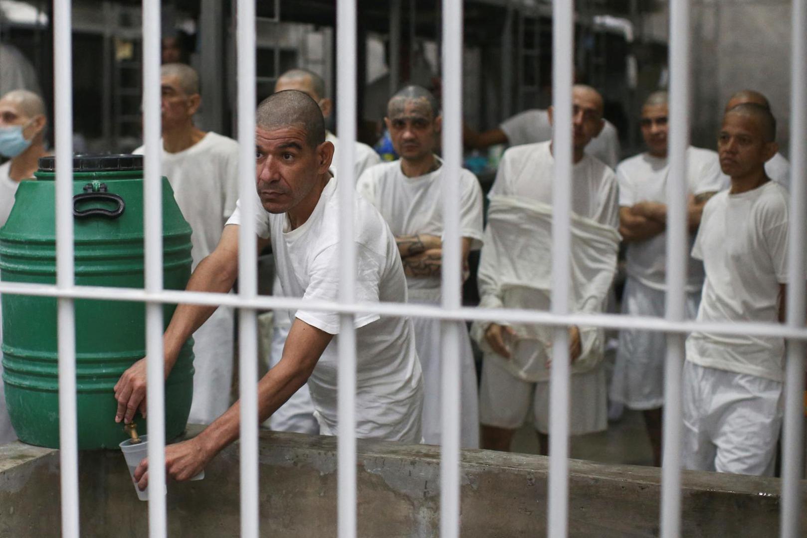 Inmates remain in their cell, during a tour in the "Terrorism Confinement Center" (CECOT) complex, which according to El Salvador's President, Nayib Bukele, is designed to hold 40,000 inmates, in Tecoluca, El Salvador October 12, 2023. REUTERS/Jose Cabezas Photo: Jose CABEZAS/REUTERS