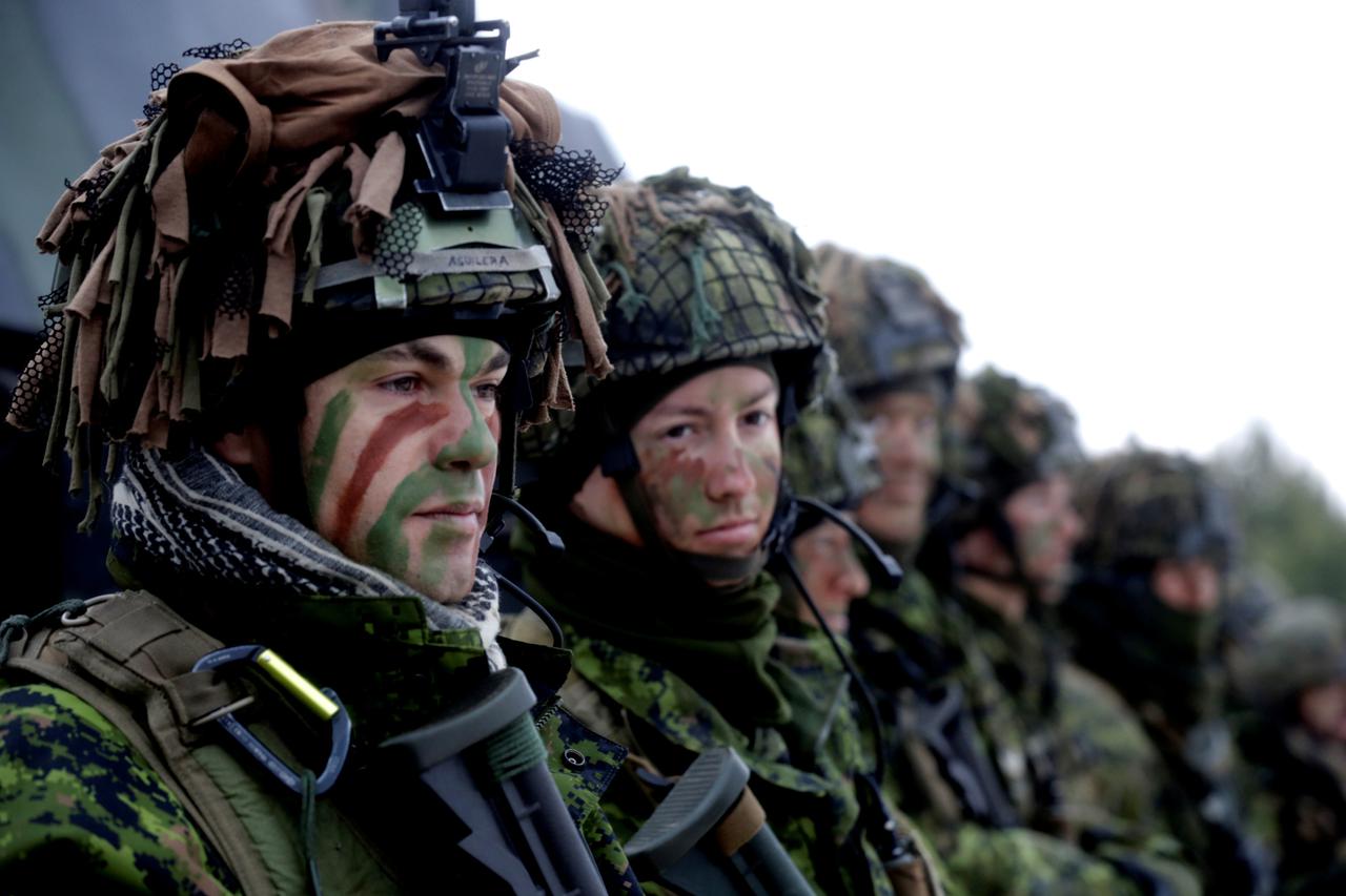 Lithuanian troops along with other troops 11 NATO nations take part in the exercise in urban warfare during Iron Sword exercise in the mock town near Pabrade Lithuanian troops along with the other troops from 11 NATO nations take part in the exercise in u