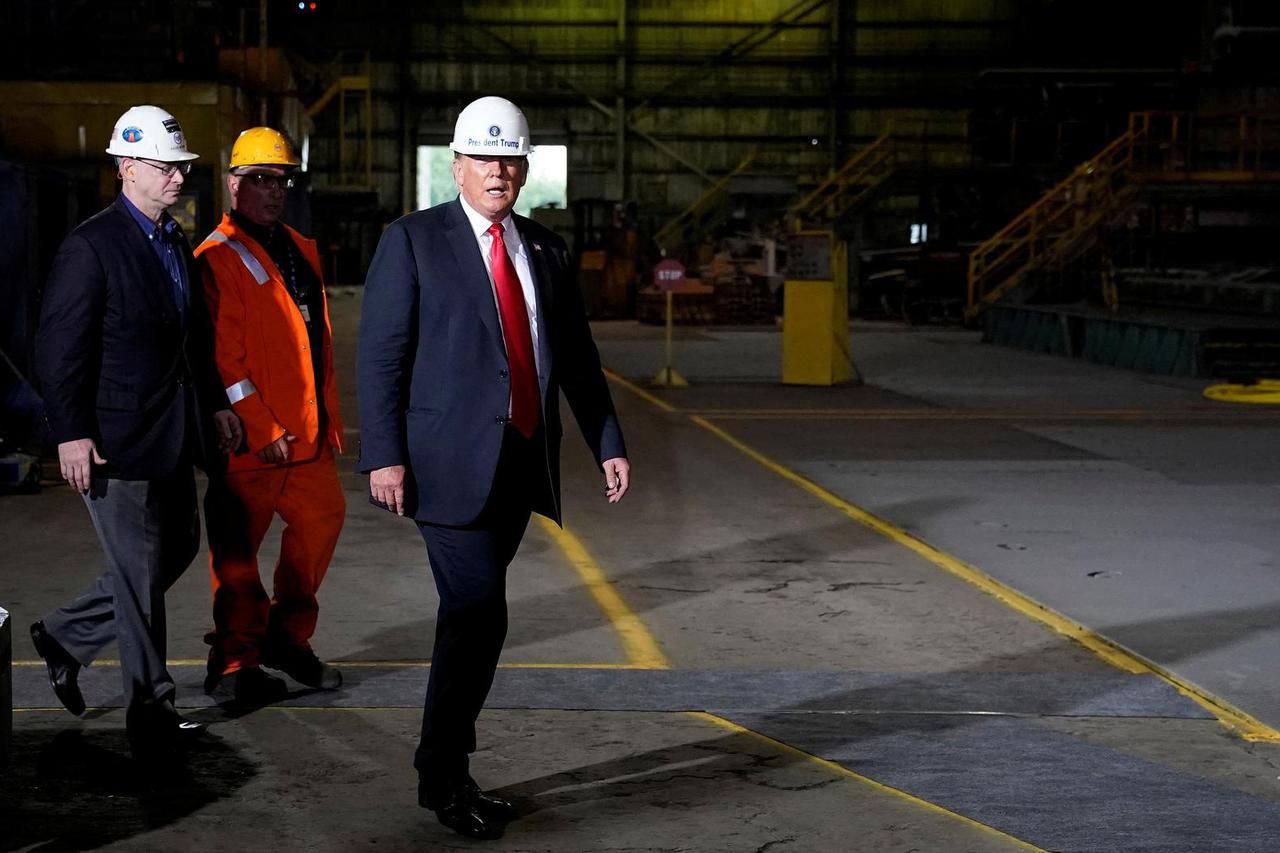 FILE PHOTO: Then-U.S. President Trump wears hardhat as he tours the Granite City Works hot strip mill in Granite City, Illinois