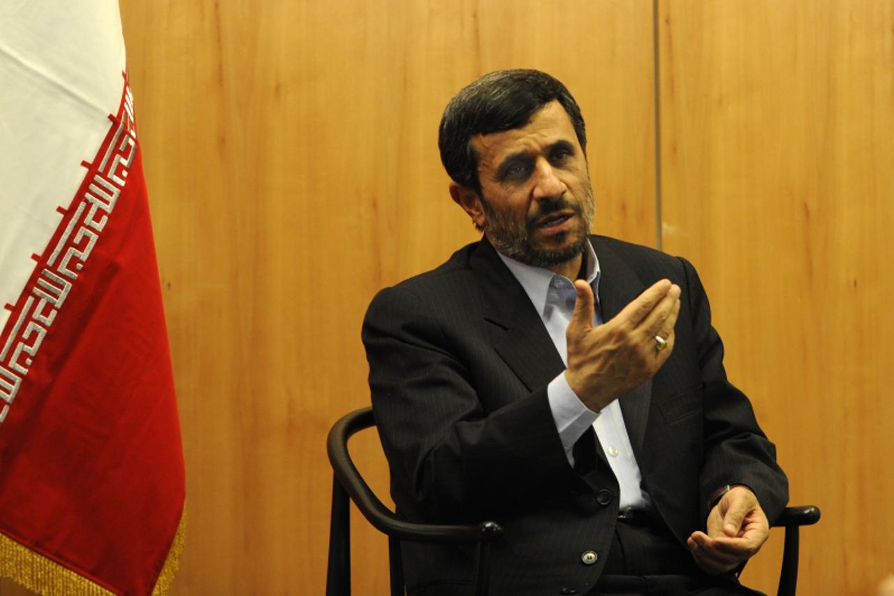'Iranian President  Mahmoud Ahmadinejad answers questions of journalists during a meeting with AFP in Copenhagen on December 18, 2009 on the sidelines of the COP15 UN Climate Change Conference.   AFP 