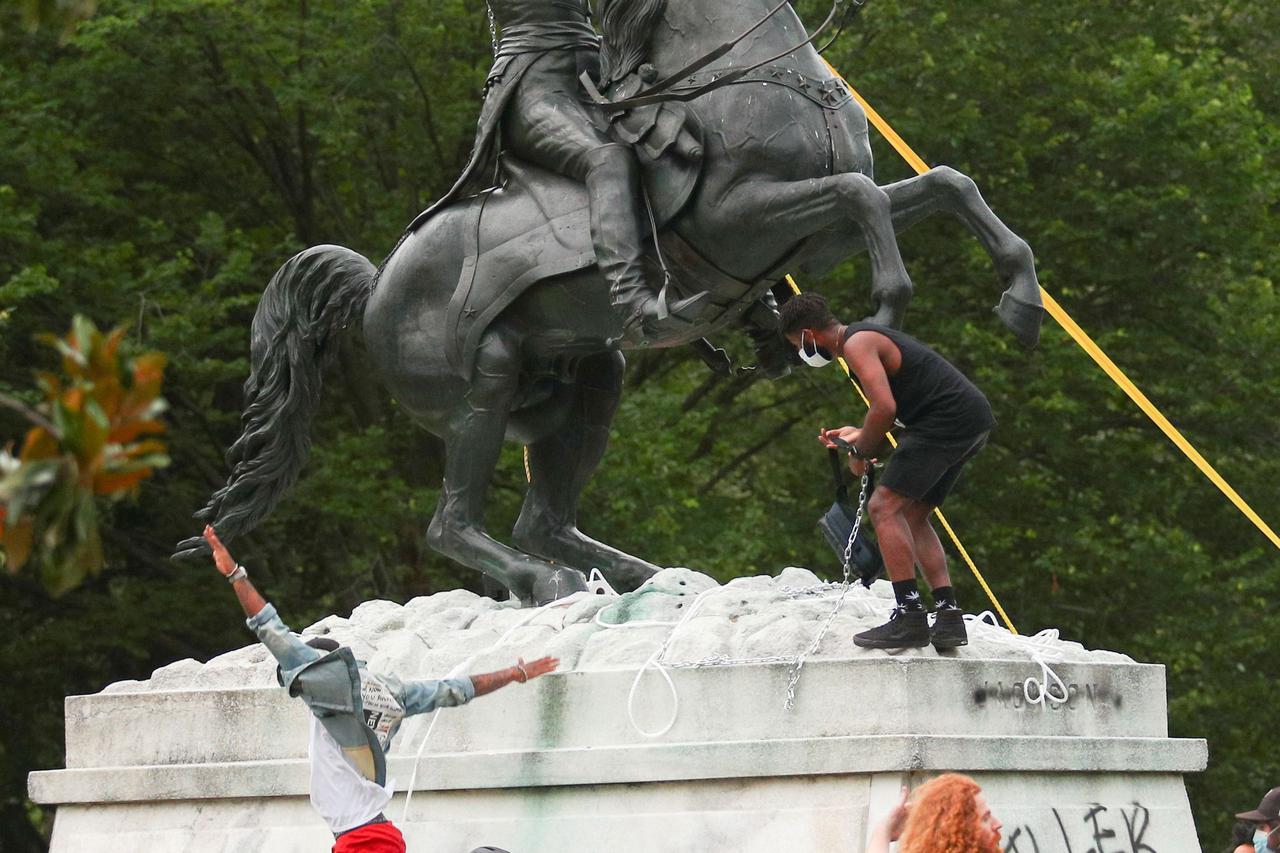 Protestors attempt to pull down the statue of U.S. President Andrew Jackson in front of the White House in Washington