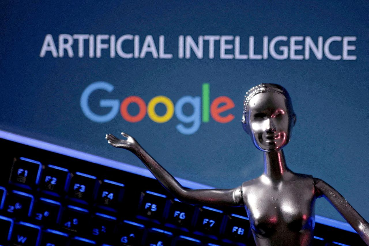 FILE PHOTO: Illustration shows Google logo and AI Artificial Intelligence words