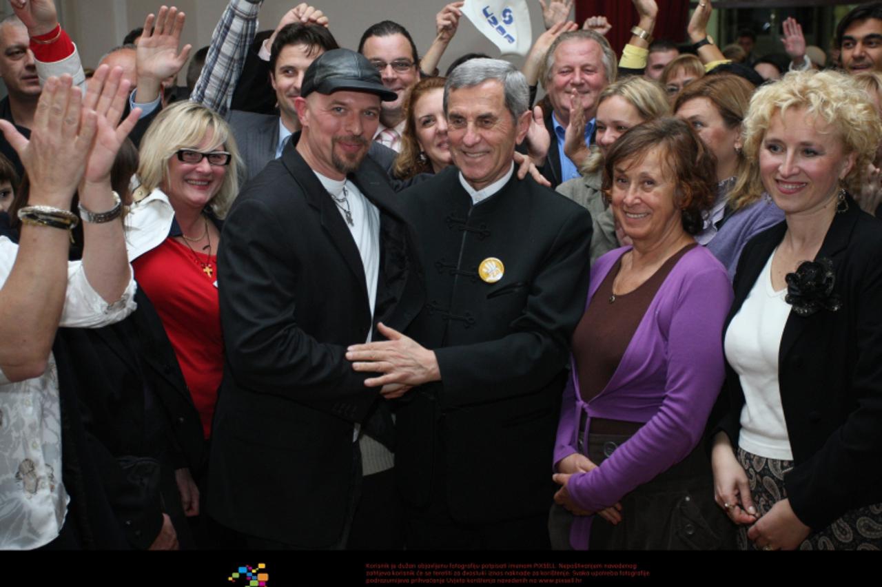 '04.12.2011., Split - Ocekivanje izbornih rezultata u stozeru SGEH (Savez za gradjansku i eticku Hrvatsku). Zadovoljstvo rezultatima nije krio don Ivan Grubisic i ostali kandidati. Pjevac Luky. Photo: