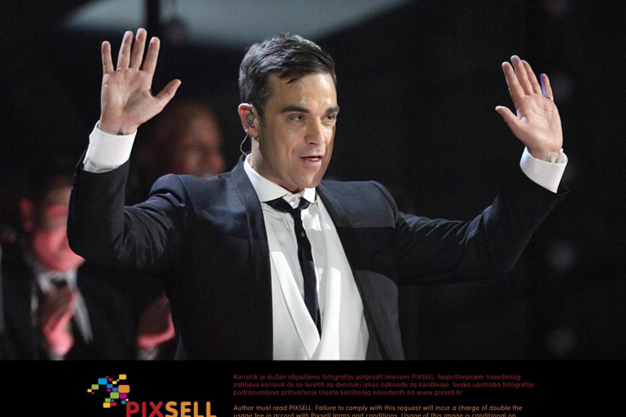 'Robbie Williams performs on stage during the BRIT Awards 2010, at Earls Court, London. Photo: Press Association/Pixsell'