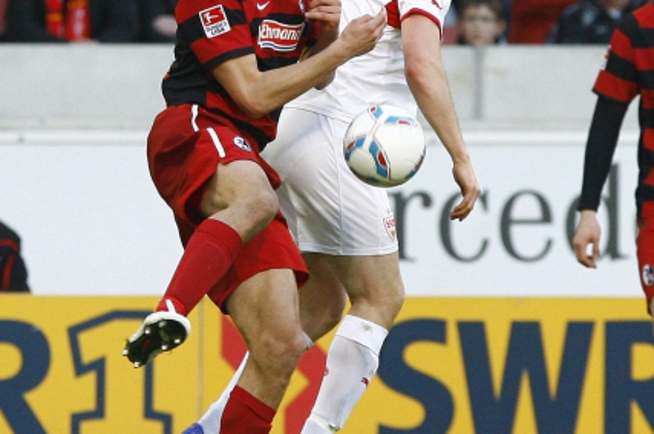 'Ivan SANTINI, SCF - William KVIST, VfB Stuttgart, Aktion hoch, Fußball Saison 2011/2012  Stuttgart, 25.02.2012, 1.Fussball Bundesliga, Saison 11/12, VfB Stuttgart - SC Freiburg, Foto: APF  Veroeffent