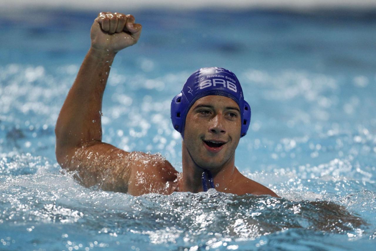 \'Vanja Udovicic of Serbia celebrates his goal against Montenegro during their European Water Polo Championships quarterfinal match in Zagreb September 7, 2010. REUTERS/Laszlo Balogh  (CROATIA - Tags: