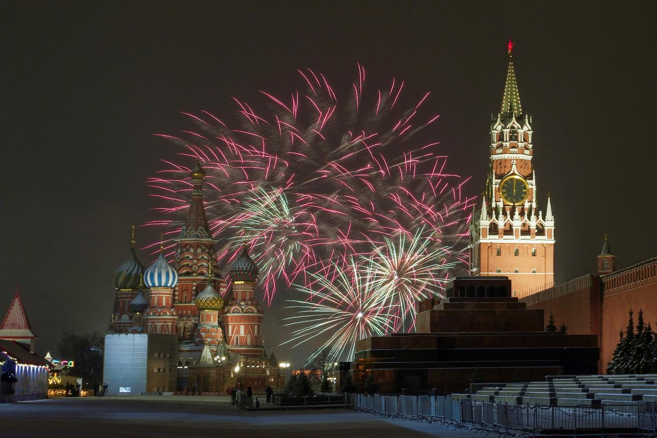 Fireworks explode in the sky over the Kremlin and St. Basil’s cathedral during the New Year's celebrations in Moscow