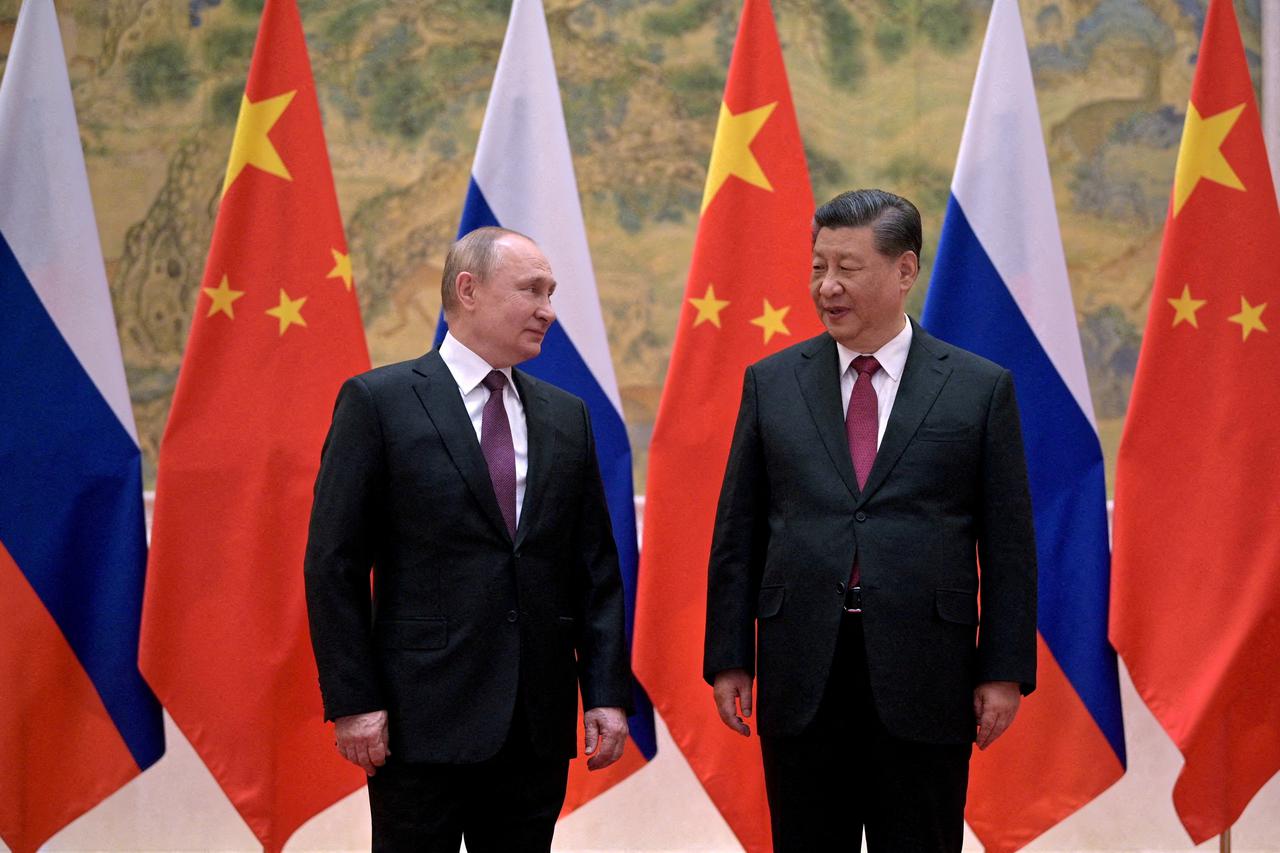 FILE PHOTO: Russian President Vladimir Putin attends a meeting with Chinese President Xi Jinping