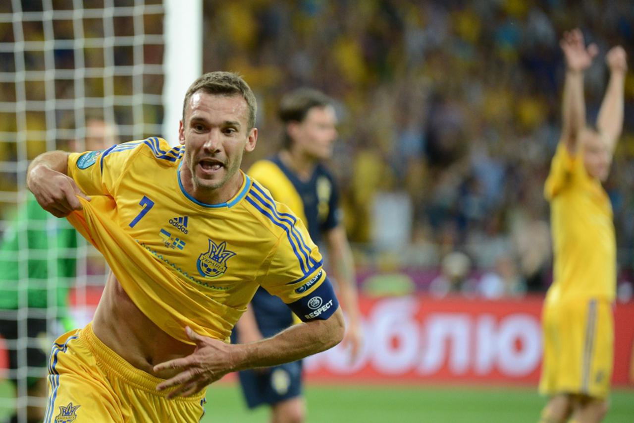 'Ukrainian forward Andriy Shevchenko celebrates after scoring his second goal during the Euro 2012 championships football match Ukraine vs Sweden on June 11, 2012 at the Olympic Stadium in Kiev.    TO