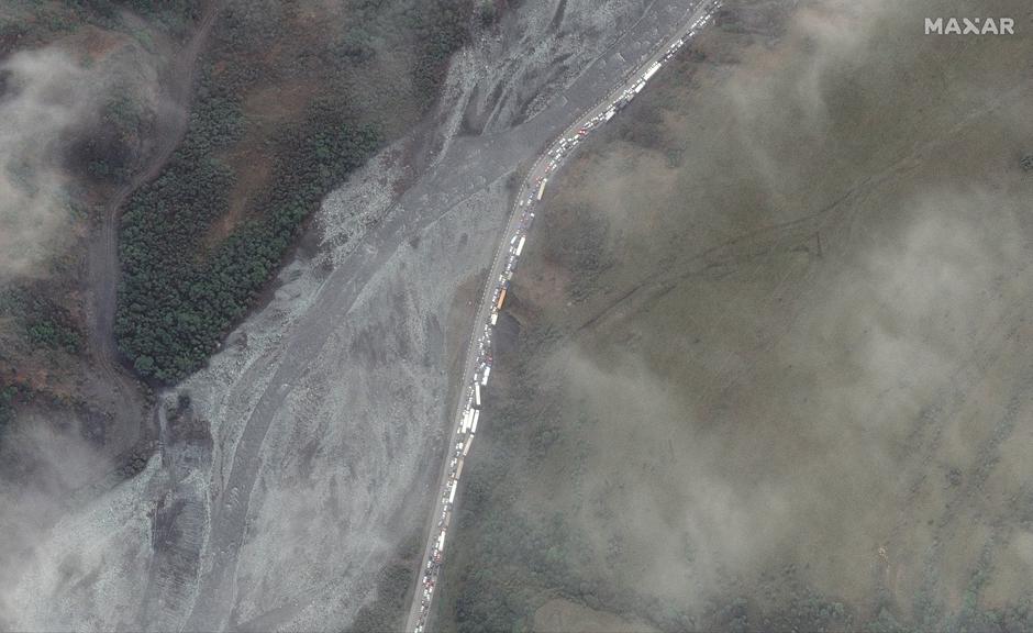 A satellite image shows trucks and cars waiting in a traffic jam near Russia's border with Georgia