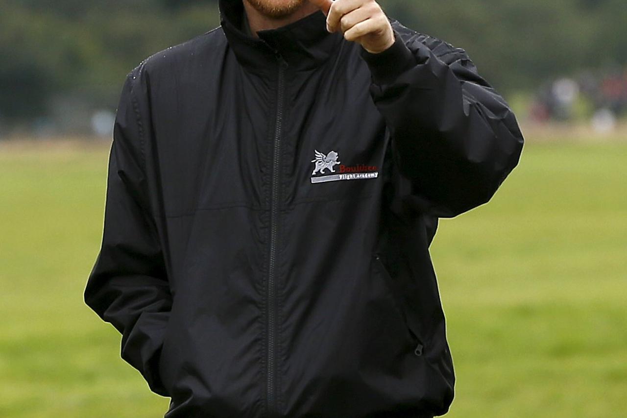 Britain's Prince Harry walks at Goodwood Aerodrome in West Sussex, England September 15, 2015. REUTERS/Kirsty Wigglesworth/Pool