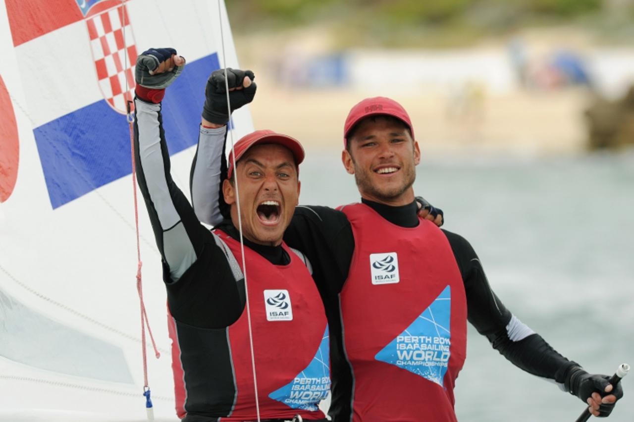'Sime Fantela (R) and Igor Marenic (L) of Croatia celebrate after winning the bronze medal in the 470 class at the ISAF World Sailing Championships off Fremantle near Perth on December 11, 2011. RESTR